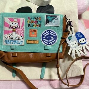 Min and Mon Victor small messenger bag in “Creatures of the Future” print